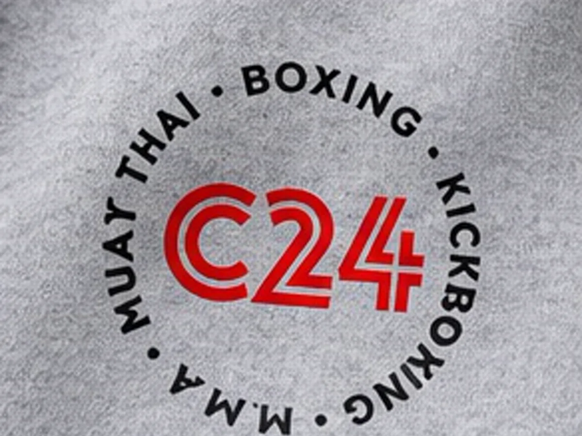 Close-up of the red C24 Muay Thai, boxing and kickboxing roundel printed on the grey hoodie
