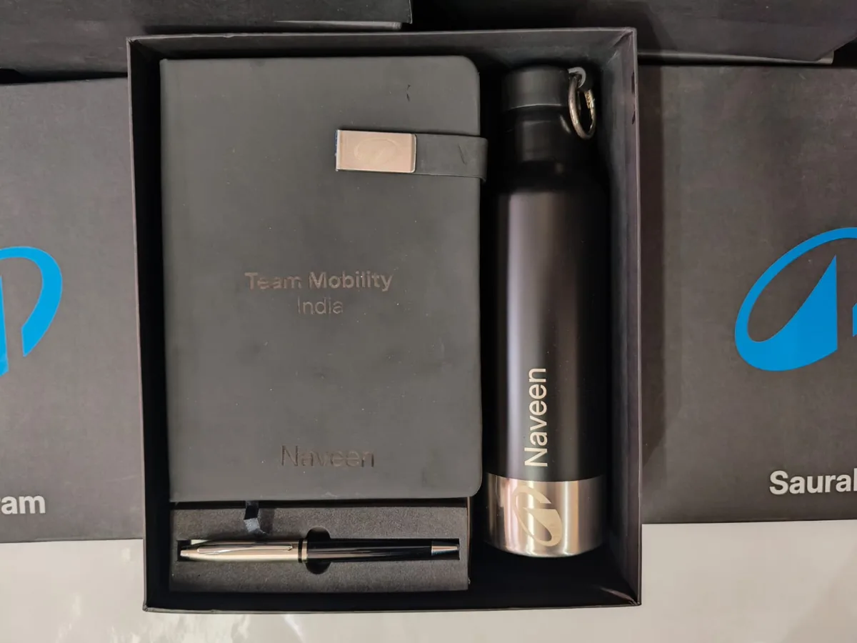 Open Decathlon Anubhava gift box with a name-personalised notebook, bottle and pen