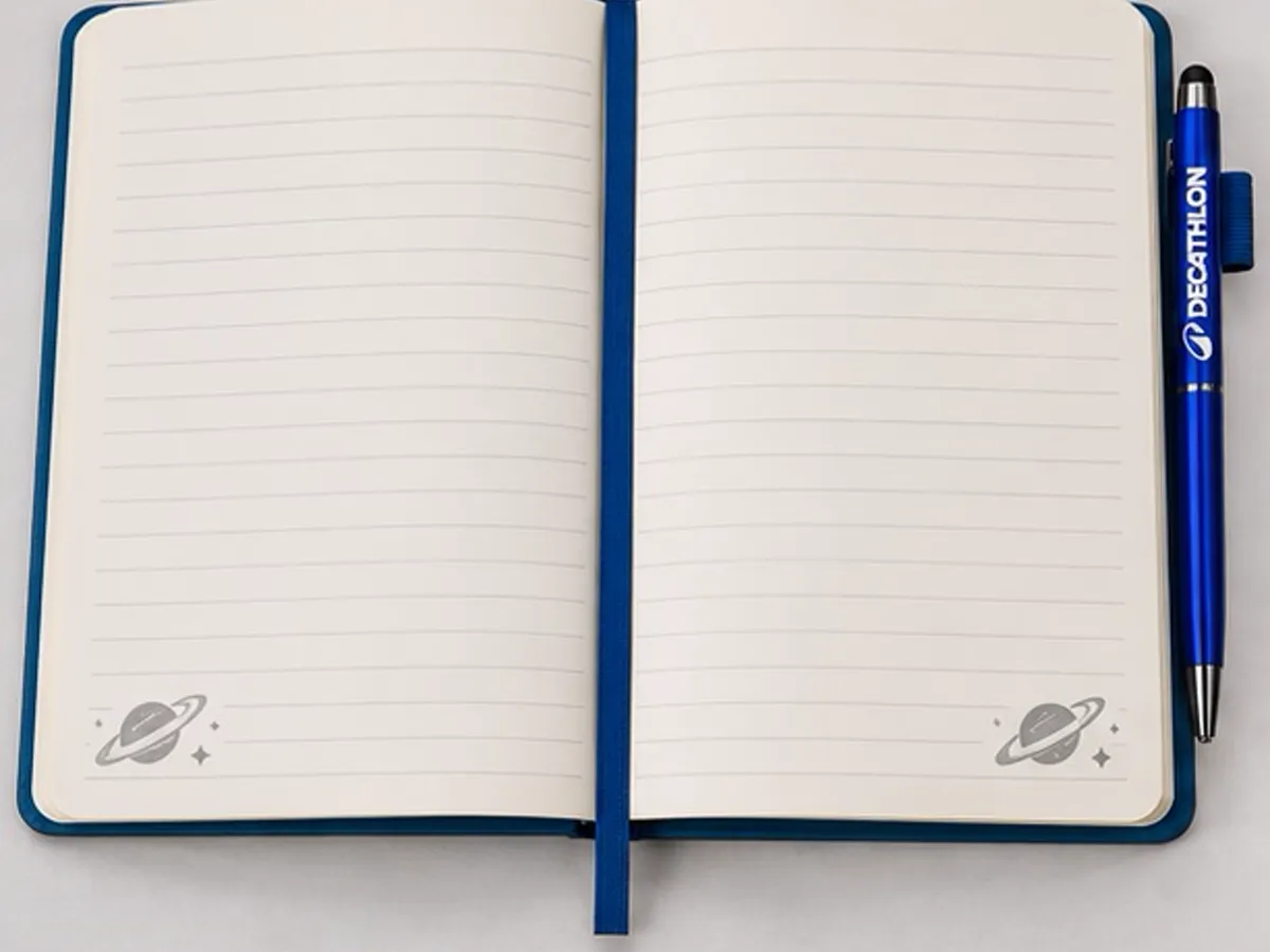 Inner ruled pages of the Decathlon Kalyan Nagar diary with branded pen