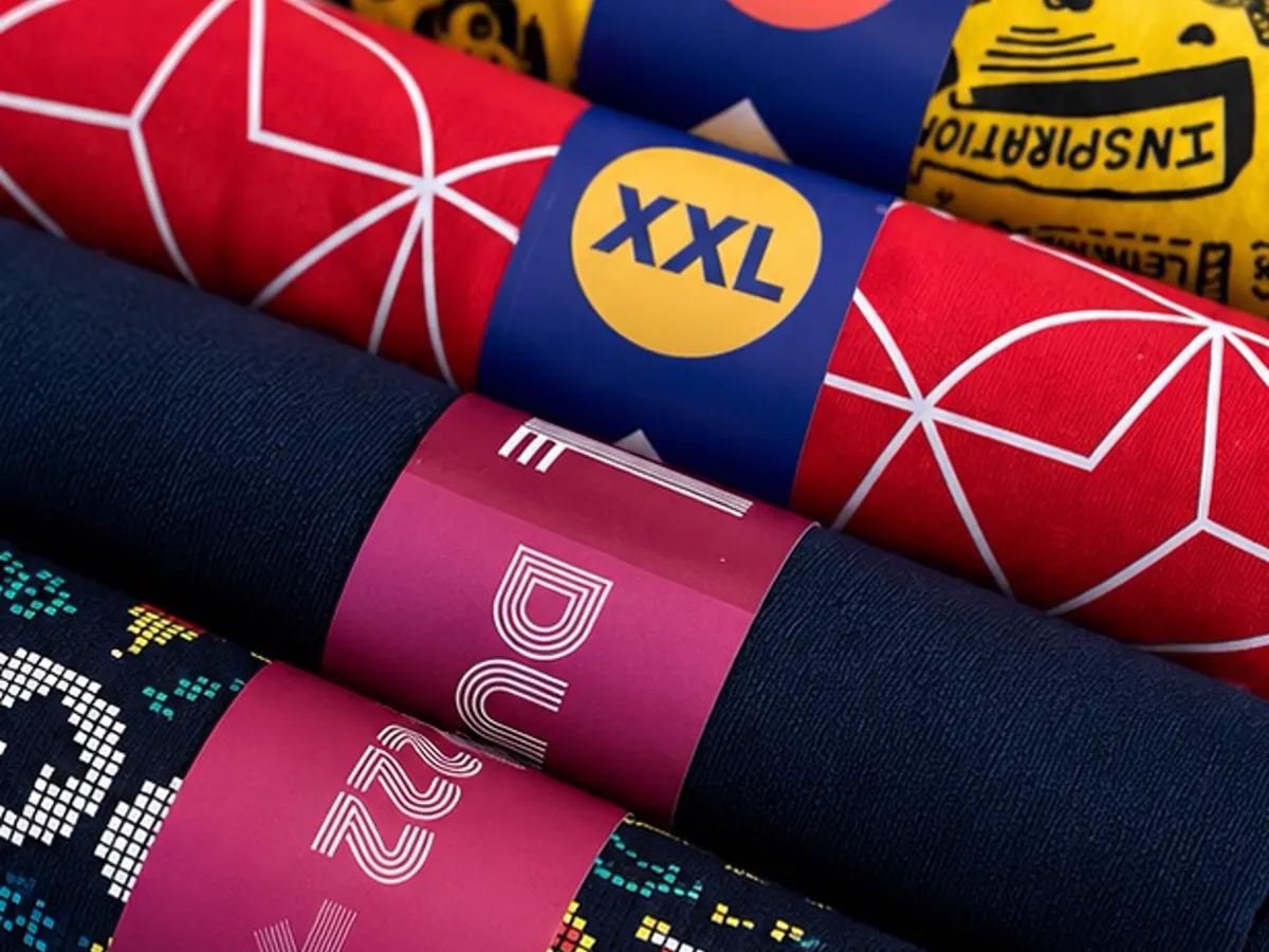 Close-up of Design Up printed T-shirt size band branding