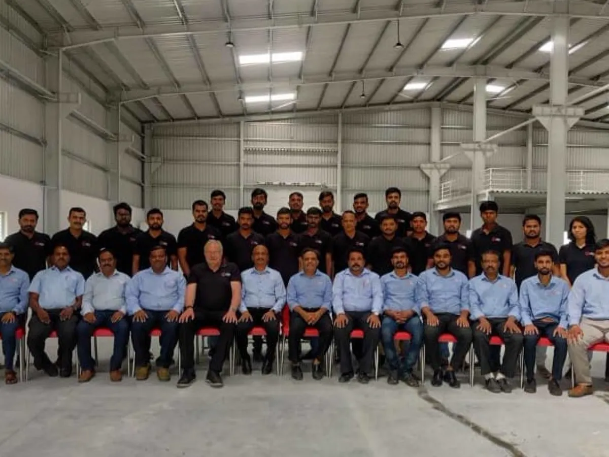 Effee team photographed wearing embroidered corporate shirts