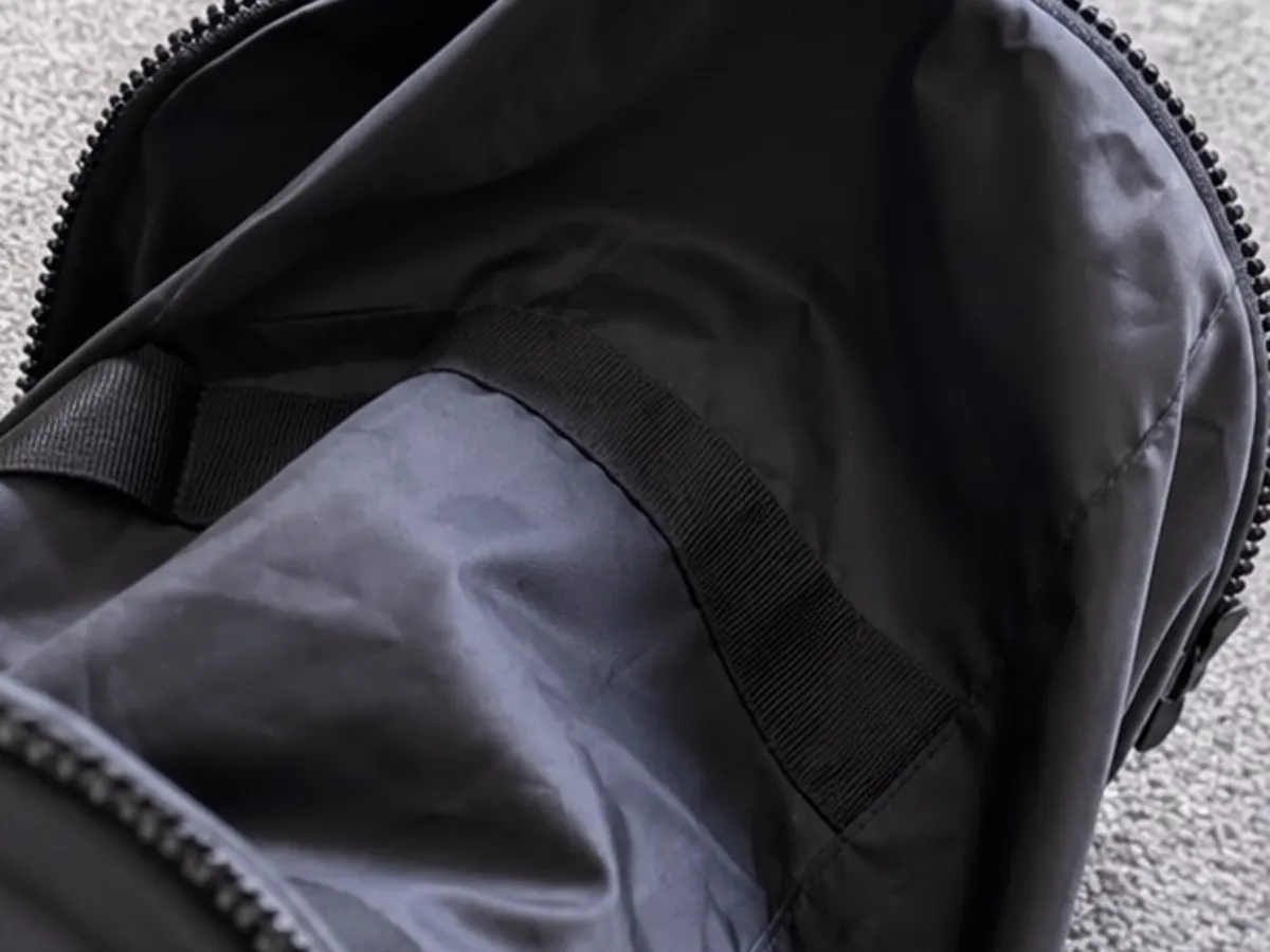 Interior lining and carry strap detail of the Google India duffle bag