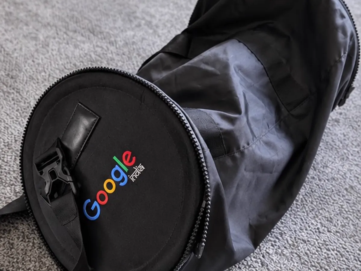 Google India branded duffle bag opened to show the main compartment