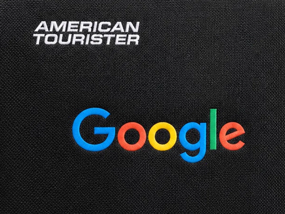 Close-up of the Google logo branding on the luggage bag fabric