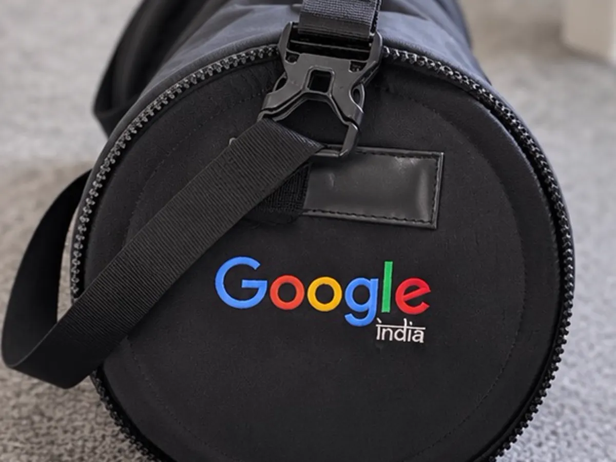 Black Google India branded duffle bag with printed logo on the round end panel