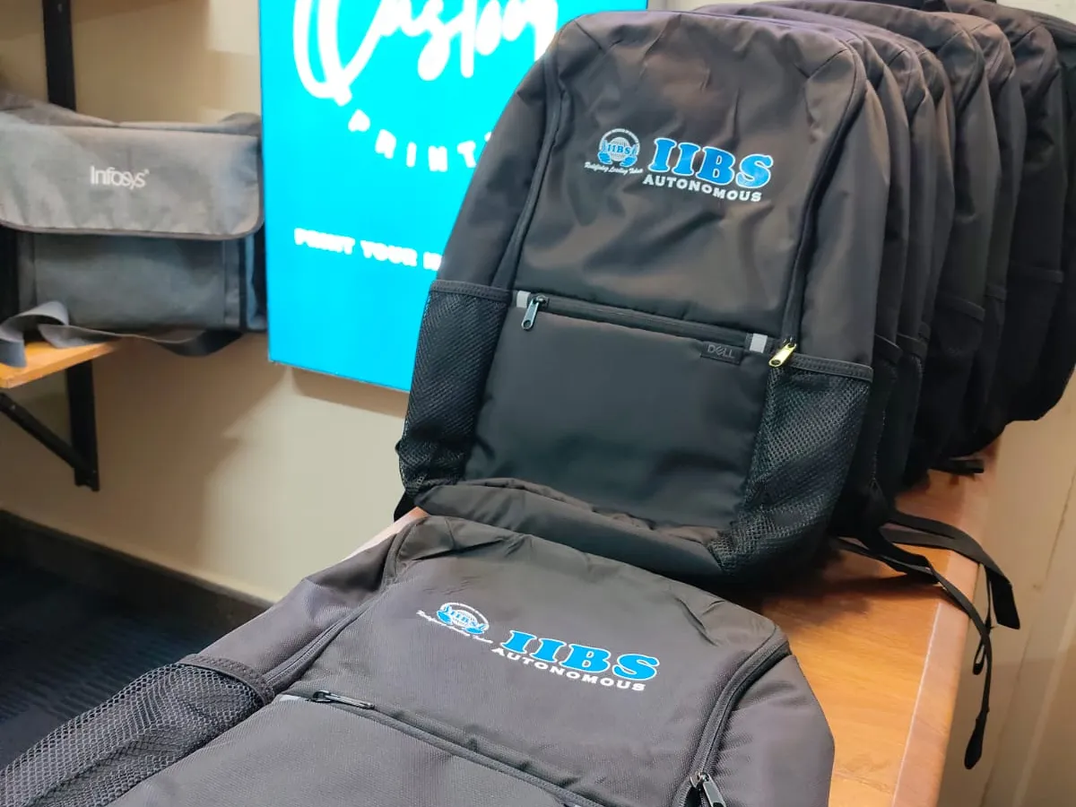 Row of printed IIBS Autonomous backpacks from the bulk order at the Customprintz unit