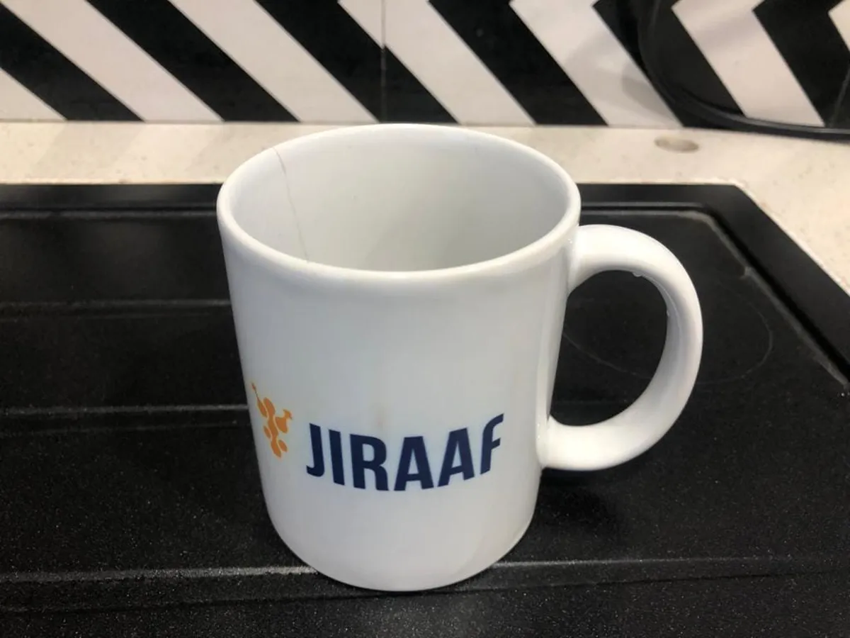 White Jiraaf mug with digitally printed navy and orange logo