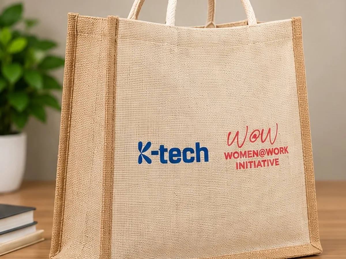 Angled view of the printed K-tech and Women@Work Initiative jute bag