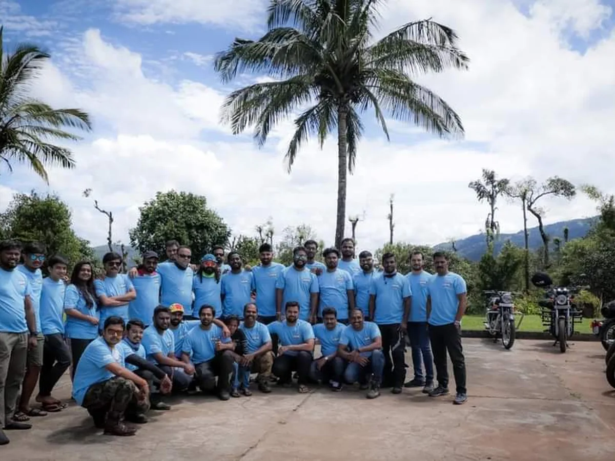 Group of Mojo Tribe riders wearing the screen printed blue cotton T-shirts