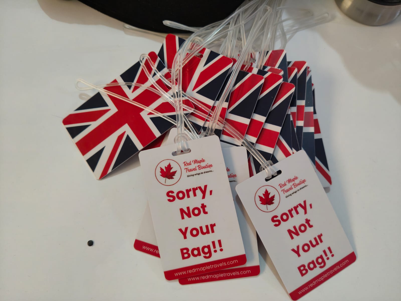 Red Maple Travel Boutique luggage tags with Union Jack backs and printed front artwork