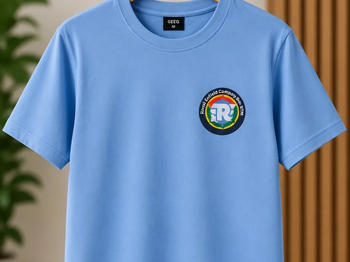 Light blue T-shirt with the small Royal Enfield Store BTM chest badge print