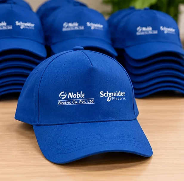 Bulk stacks of blue Schneider Electric and Noble Electric printed caps