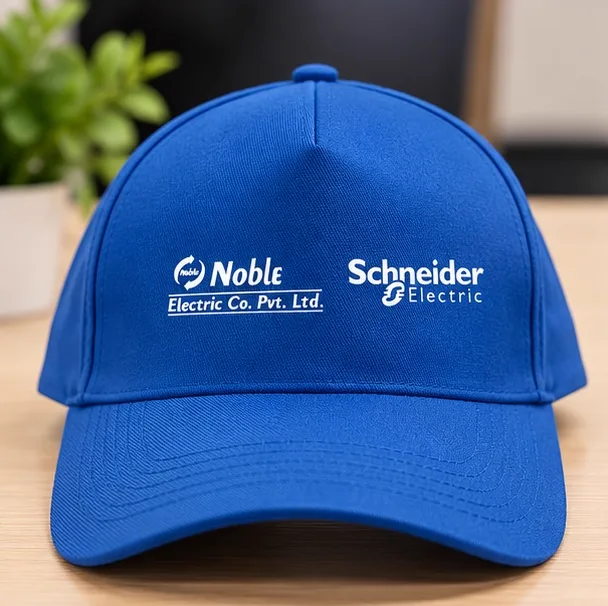 Blue cap screen printed with the Noble Electric Co. and Schneider Electric logos
